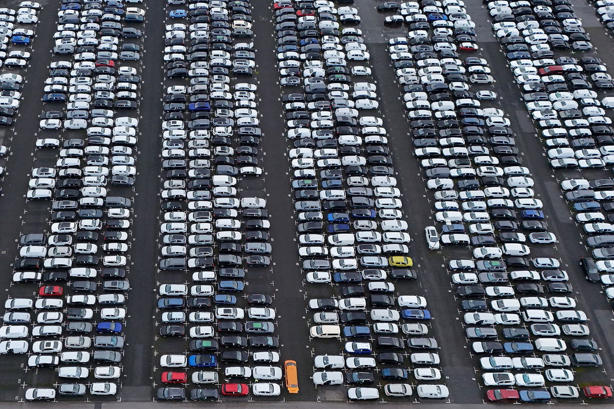 <i>Ina Fassbender/AFP/Getty Images via CNN Newsource</i><br/>Aerial view shows new cars of various brands that are parked ready for sale at a car logistics terminal in Essen