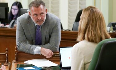 Democratic Assembly member Adam Gray discusses legislation with a colleague at the Capitol in Sacramento