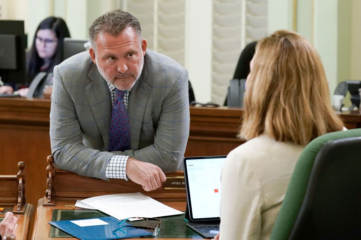 <i>Rich Pedroncelli/AP/File via CNN Newsource</i><br/>Democratic Assembly member Adam Gray discusses legislation with a colleague at the Capitol in Sacramento