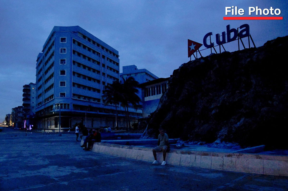 <i>Norlys Perez/Reuters/File via CNN Newsource</i><br/>People gather in a plaza as Cuba is hit by an island-wide blackout