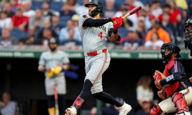 Minnesota Twins shortstop Carlos Correa hits a single against the Cleveland Guardians on September 18.