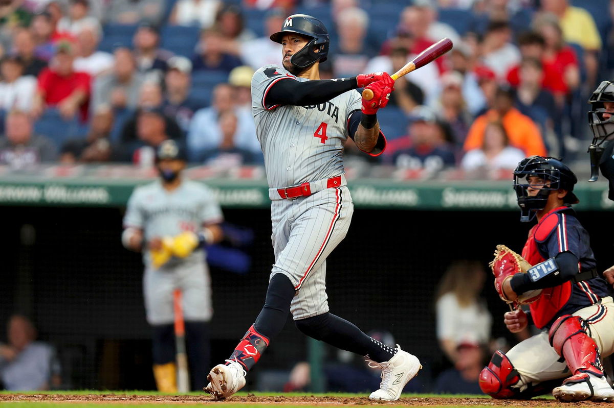 <i>Frank Jansky/Icon Sportswire/AP via CNN Newsource</i><br/>Minnesota Twins shortstop Carlos Correa hits a single against the Cleveland Guardians on September 18.