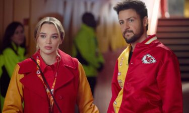 Hunter King and Tyler Hynes in Hallmark's "Holiday Touchdown: A Chiefs Love Story."