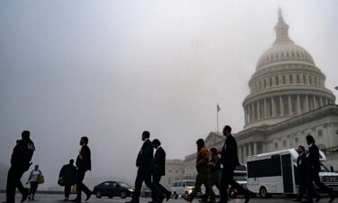 Fog hovers over the dome of the US Capitol on December 10