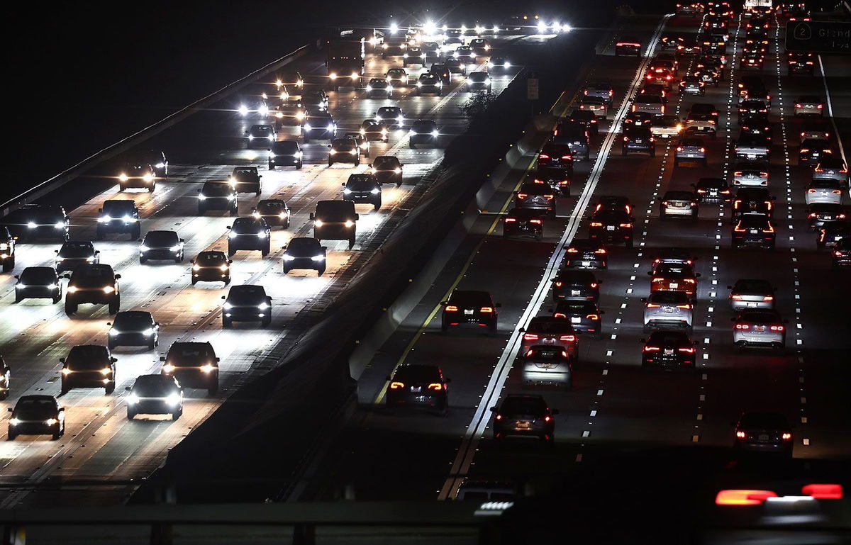 <i>Mario Tama/Getty Images via CNN Newsource</i><br/>Motorists drive cars and other vehicles during the late afternoon commute on December 16 in Los Angeles.