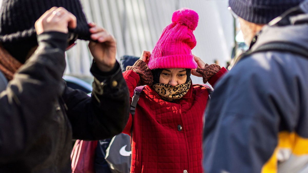 <i>Eduardo Munoz/Reuters via CNN Newsource</i><br/>People brace against cold weather in New York City on December 6.