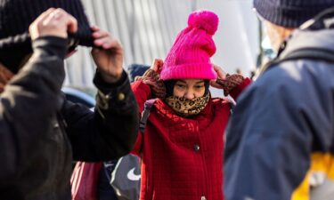 People brace against cold weather in New York City on December 6.