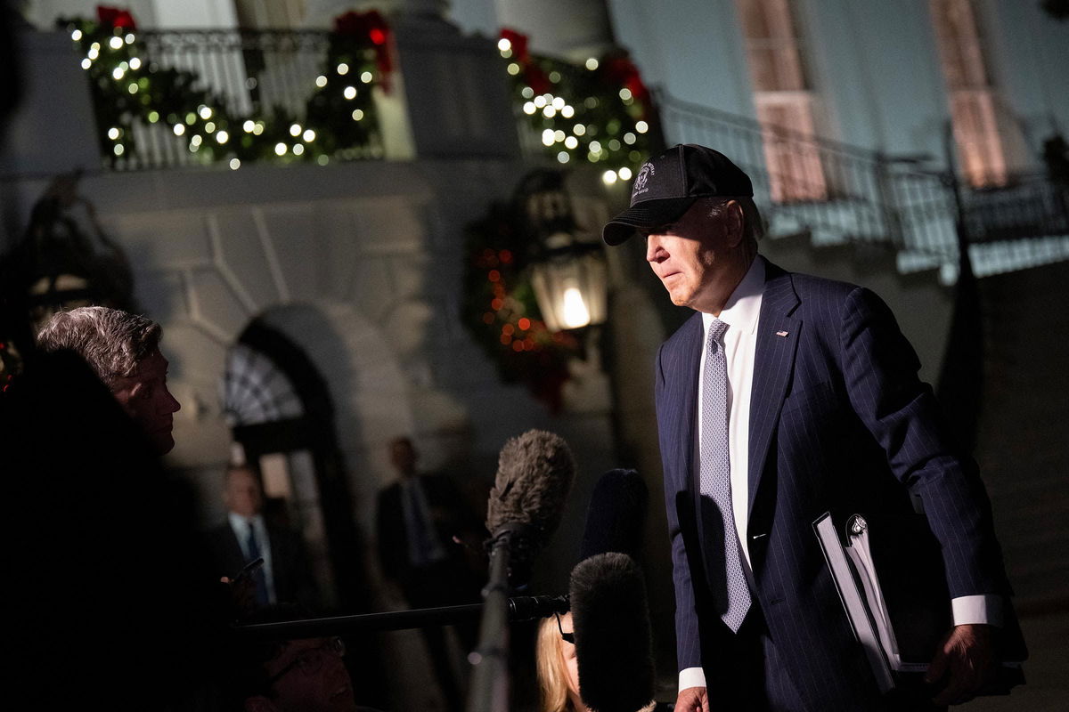 <i>Drew Angerer/AFP/Getty Images via CNN Newsource</i><br/>President Joe Biden speaks to reporters as he departs the White House en route to Wilmington