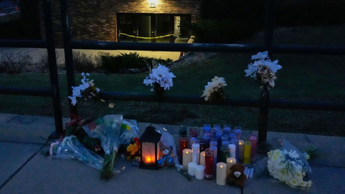 <i>Nam Y.Huh/AP via CNN Newsource</i><br/>Flowers and candles are placed outside the Abundant Life Christian School in Madison