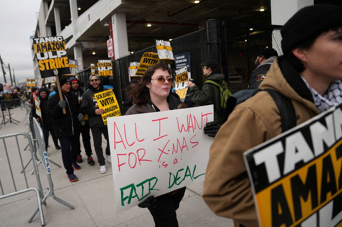 <i>Adam Gray/Reuters via CNN Newsource</i><br/>Amazon workers and supporters take part in a strike organised by the Teamsters union at the Amazon facility in the Queens borough of New York City on December 20.