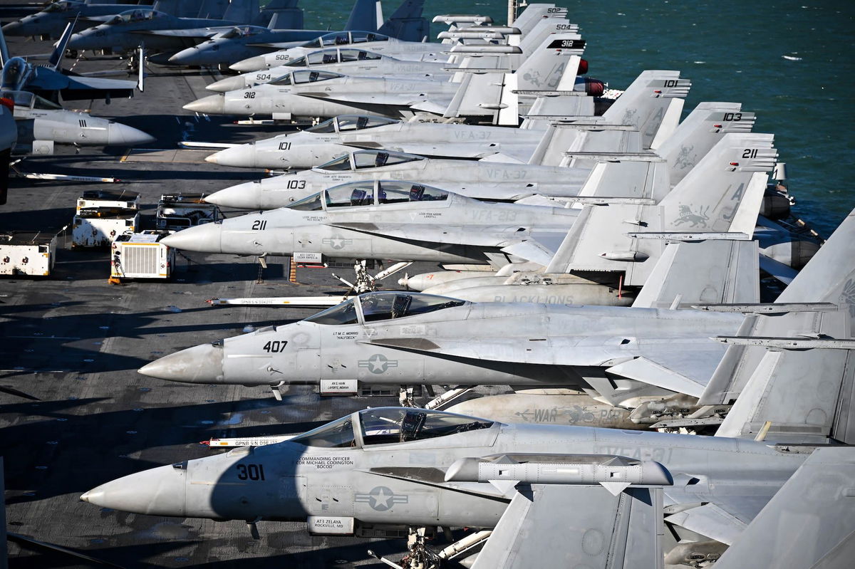 <i>Finnbarr Webster/Getty Images/File via CNN Newsource</i><br/>F-18 fighter jets are seen on the flight deck of USS Gerald R. Ford in November 2022