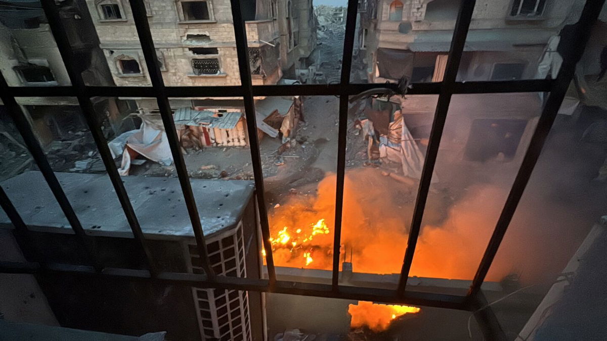 <i>Stringer/Reuters via CNN Newsource</i><br/>A fire burns outside Kamal Adwan hospital in Beit Lahiya during an ongoing Israeli military operation.