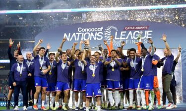 The USMNT celebrates with the trophy after winning the Concacaf Nations League final match against Mexico at AT&T Stadium on March 24.