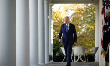 President Joe Biden walks to the Rose Garden to deliver remarks at the White House on November 26.