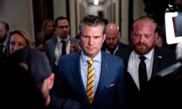 Pete Hegseth walks through the Russell Senate Office Building on Capitol Hill on December 3