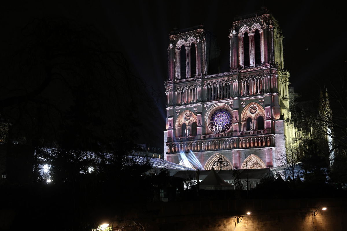 <i>Pascal Le Segretain/Getty Images for Notre-Dame de Paris via CNN Newsource</i><br/>A light show is projected on the facade of Notre Dame.