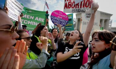 Abortion rights advocates and anti-abortion opponents clash outside the US Supreme Court on April 24 in Washington