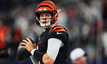 Joe Burrow of the Cincinnati Bengals warms up before kickoff against the Dallas Cowboys on Monday in Arlington