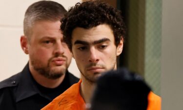 Luigi Mangione is escorted from the Blair County Court House in Hollidaysburg