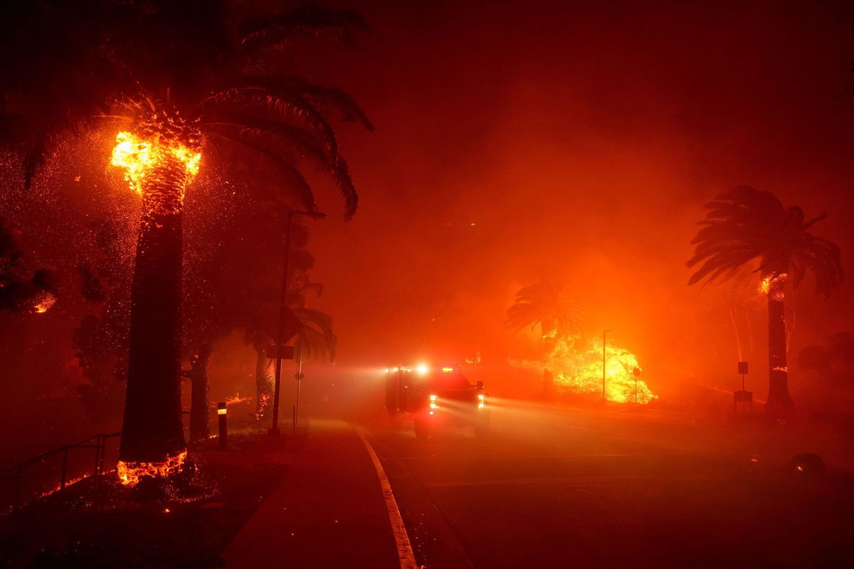 <i>Eric Thayer/AP via CNN Newsource</i><br/>Firefighters drive through Pepperdine University as the Franklin Fire approaches.