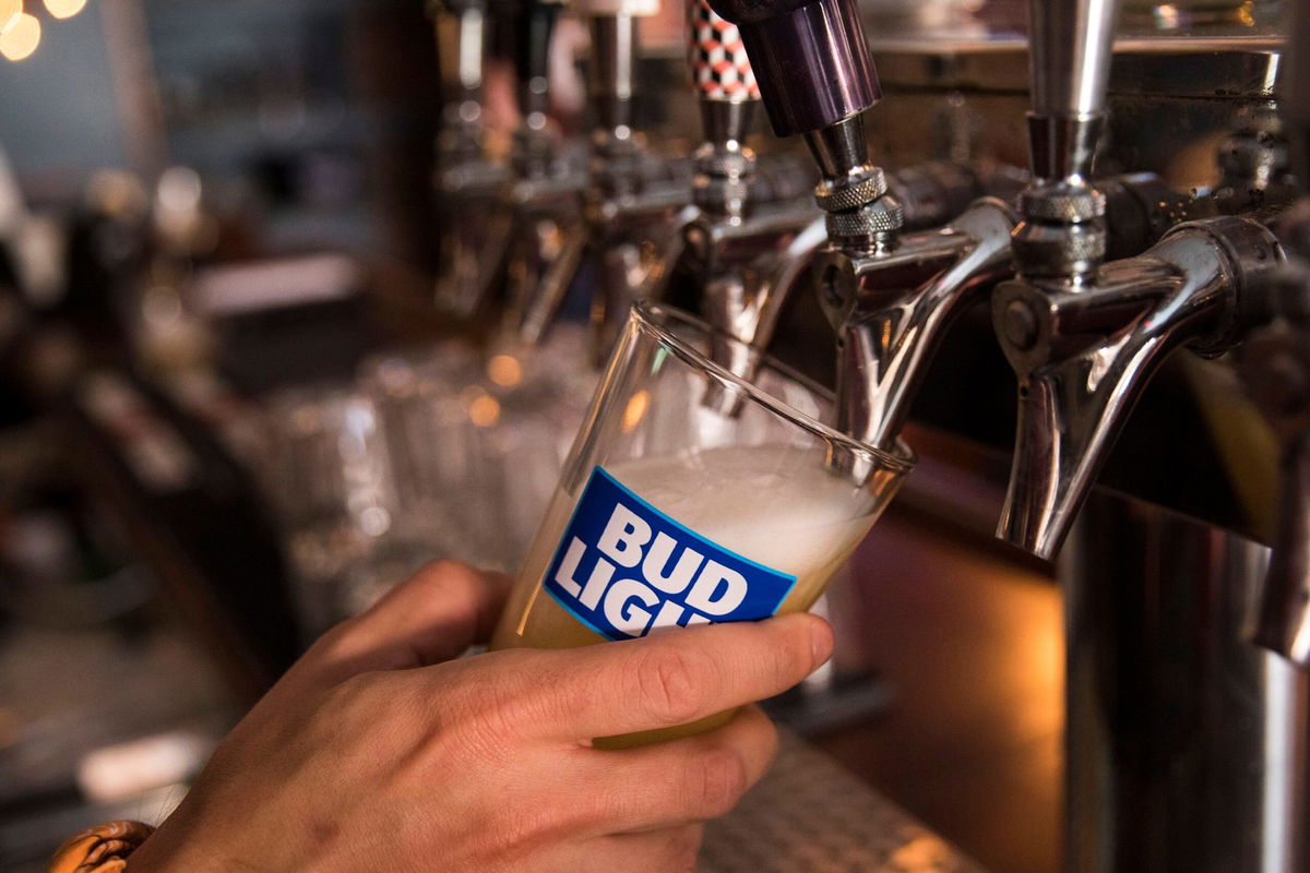 <i>Drew Angerer/Getty Images/File via CNN Newsource</i><br/>A bartender pours a Bud Light from a tap.