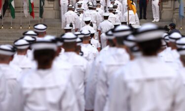 Incoming plebes march into Bancroft Hall after taking part in their oath of office ceremony during Induction Day at the US Naval Academy in June 2023 in Annapolis