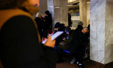 People take shelter inside a metro station during a Russian military strike in Kyiv