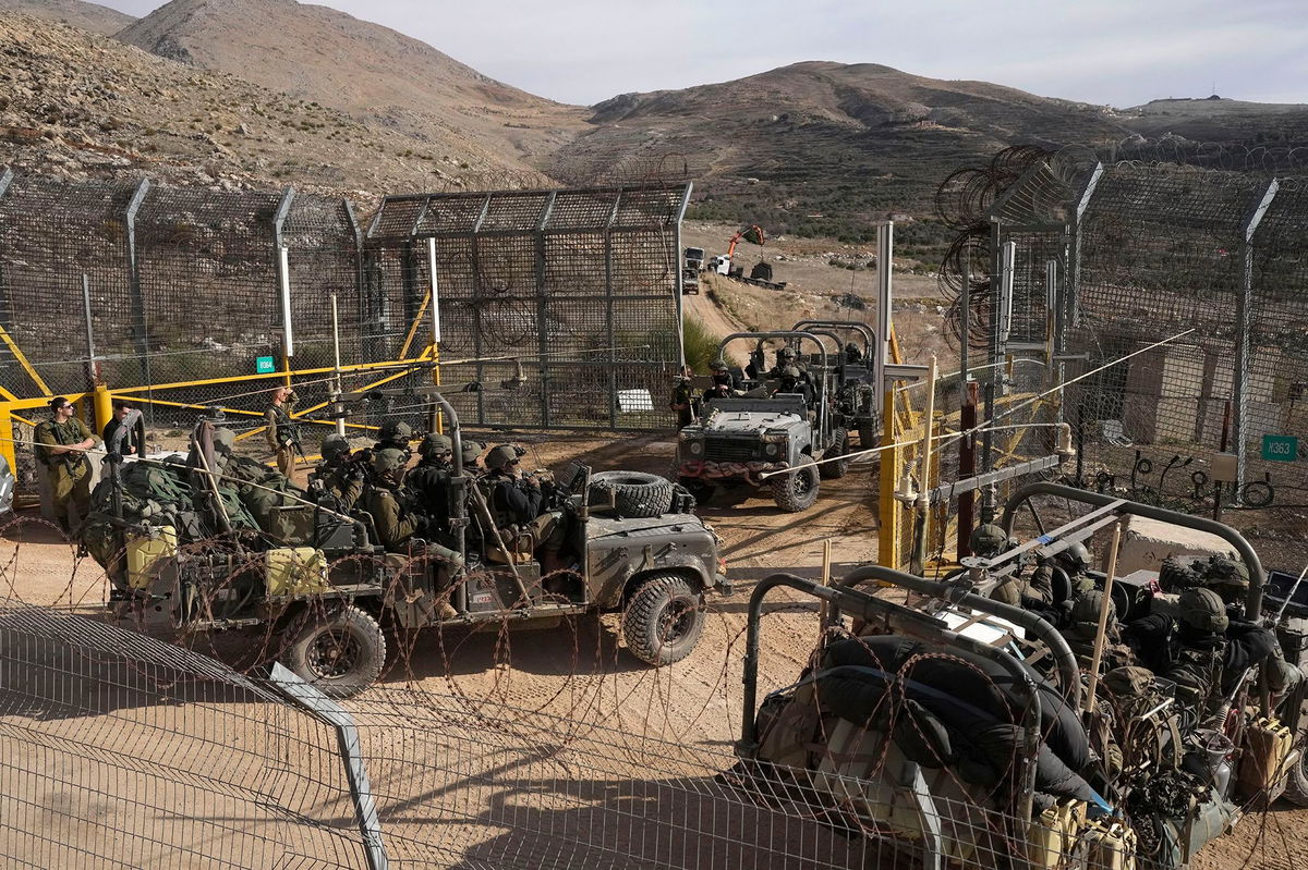 <i>Matias Delacroix/AP via CNN Newsource</i><br/>Israeli armored vehicles at the demilitarized buffer zone in the Golan Heights.