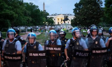 U.S. Park Police keep protesters back after they attempted to pull down the statue of Andrew Jackson in Lafayette Square near the White House on June 22 in Washington.