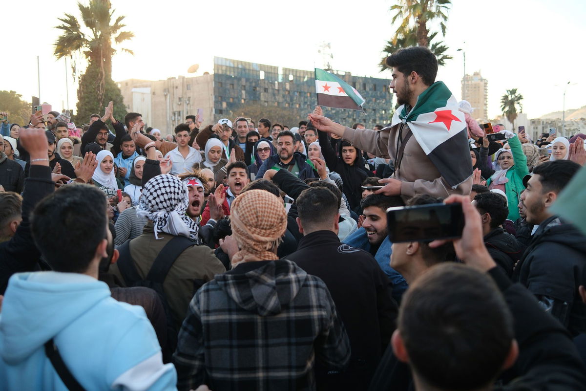 <i>Ivana Kottasova/CNN via CNN Newsource</i><br/>People dance and sing at the Umayyad Square