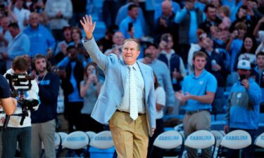 Belichick waves to the crowd in Chapel Hill.