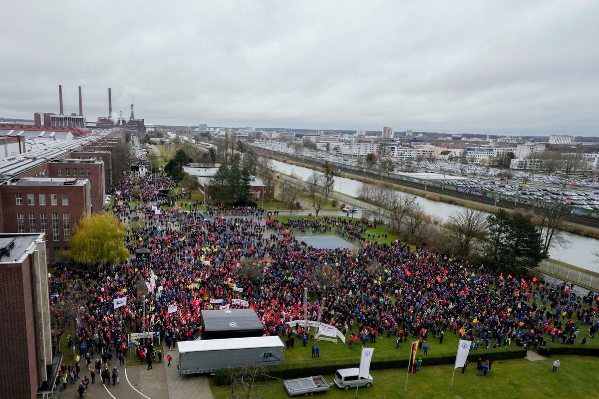 <i>Martin Meissner/Pool/AFP/Getty Images via CNN Newsource</i><br/>Employees attend a metalworkers' union rally in front of automaker Volkswagen's headquarters during a warning strike at its main factory in Wolfsburg