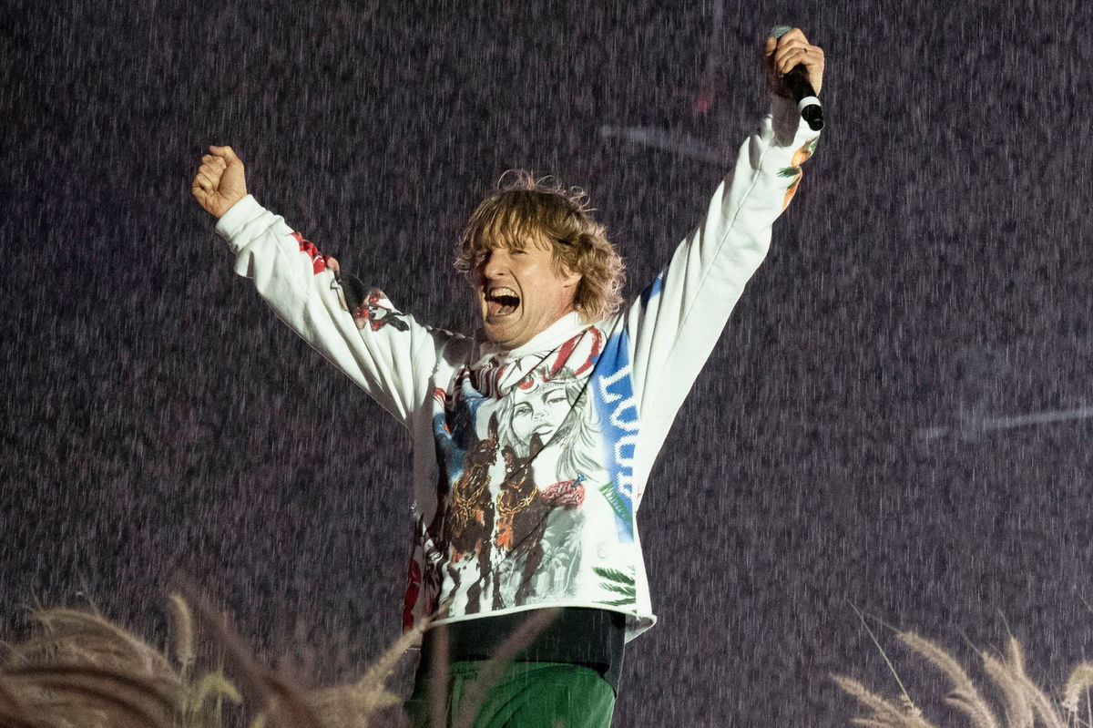 <i>Astrida Valigorsky/WireImage/Getty Images via CNN Newsource</i><br/>Owen Wilson on stage during Travis Scott's set at the Rolling Loud music festival on December 14 in Miami.