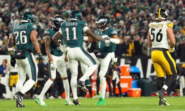 Brown and Hurts celebrate together after connecting for a touchdown.