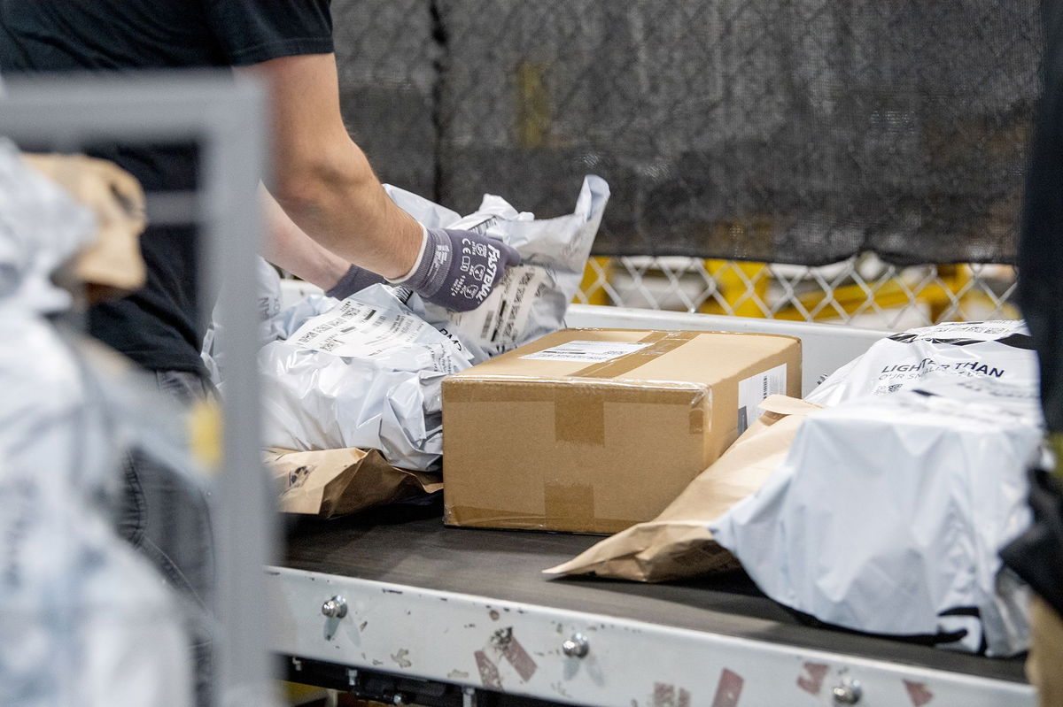 <i>Johnny Milano/Bloomberg/Getty Images via CNN Newsource</i><br/>Workers fulfill orders at an Amazon fulfillment center on in Melville