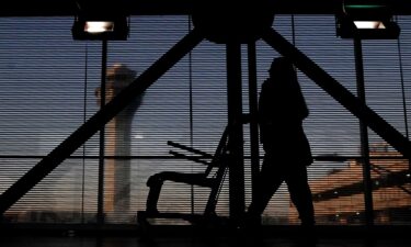 An airline employee transfers a wheelchair at O'Hare International Airport in Chicago in November 2022.