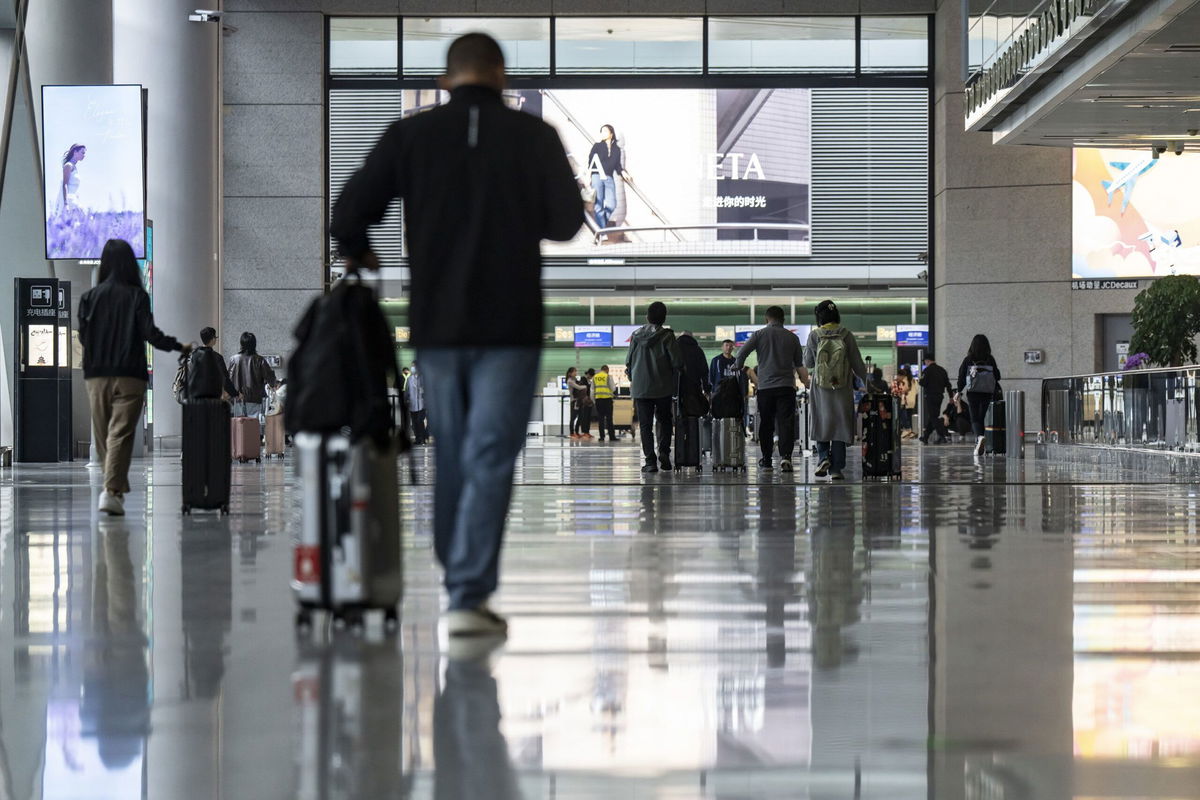 <i>Qilai Shen/Bloomberg/Getty Images via CNN Newsource</i><br/>Travelers at Hongqiao International Airport in Shanghai