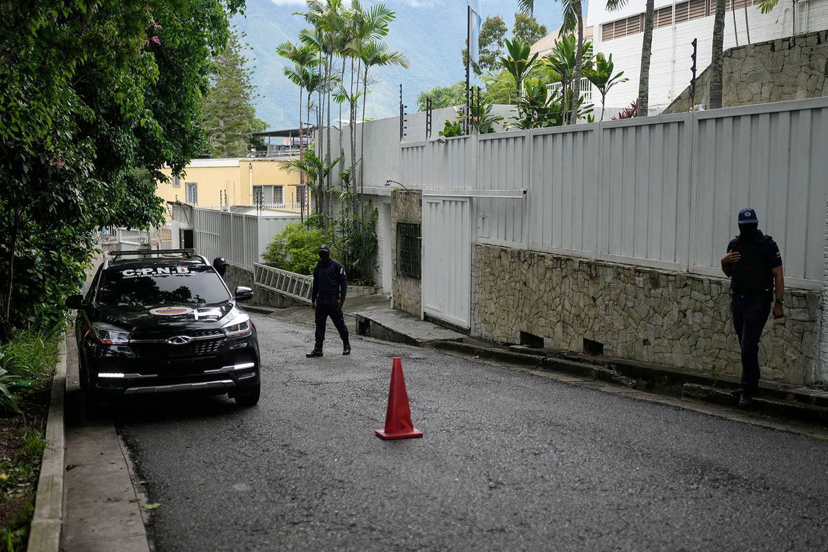 <i>Matias Delacroix/AP/File via CNN Newsource</i><br/>A police car outside Argentina's embassy in Caracas