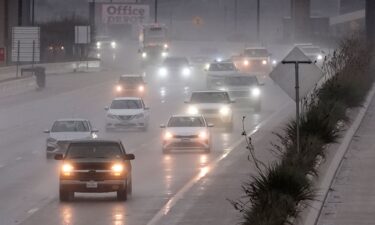 Vehicles make their way on a rain-soaked highway in Dallas on December 26.