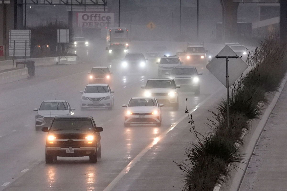 <i>LM Otero/AP via CNN Newsource</i><br/>Vehicles make their way on a rain-soaked highway in Dallas on December 26.