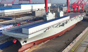 A launching ceremony is held to unveil China's first Type 076 new-generation amphibious assault ship