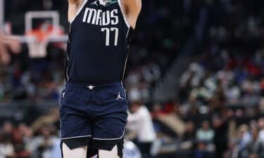 Luka Doncic #77 of the Dallas Mavericks shoots the ball against the Washington Wizards during the second half at Capital One Arena on December 5