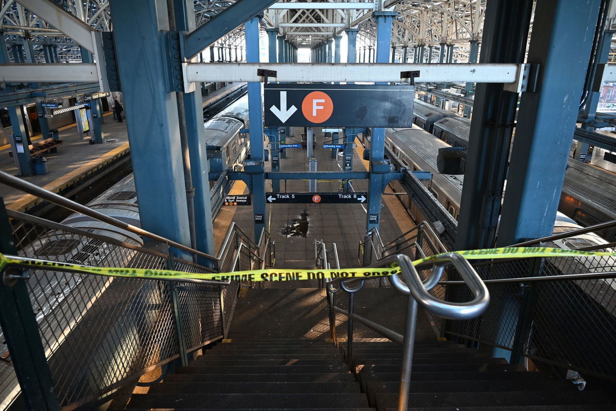 <i>Kyle Mazza/Anadolu/Getty Images via CNN Newsource</i><br/>Police take security measures at the scene where a woman died after being lit on fire by a man aboard a subway train as she slept.