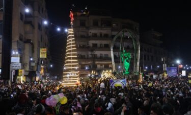 People attend a Christmas tree lighting in the Druze-majority area of Jaramana