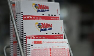 Lottery tickets for a Mega Millions jackpot of $1.58 billion are seen in a store in August 2023.