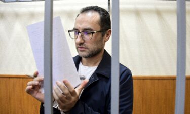 Eugene Spector is pictured behind bars in a Moscow courtroom in February 2020.