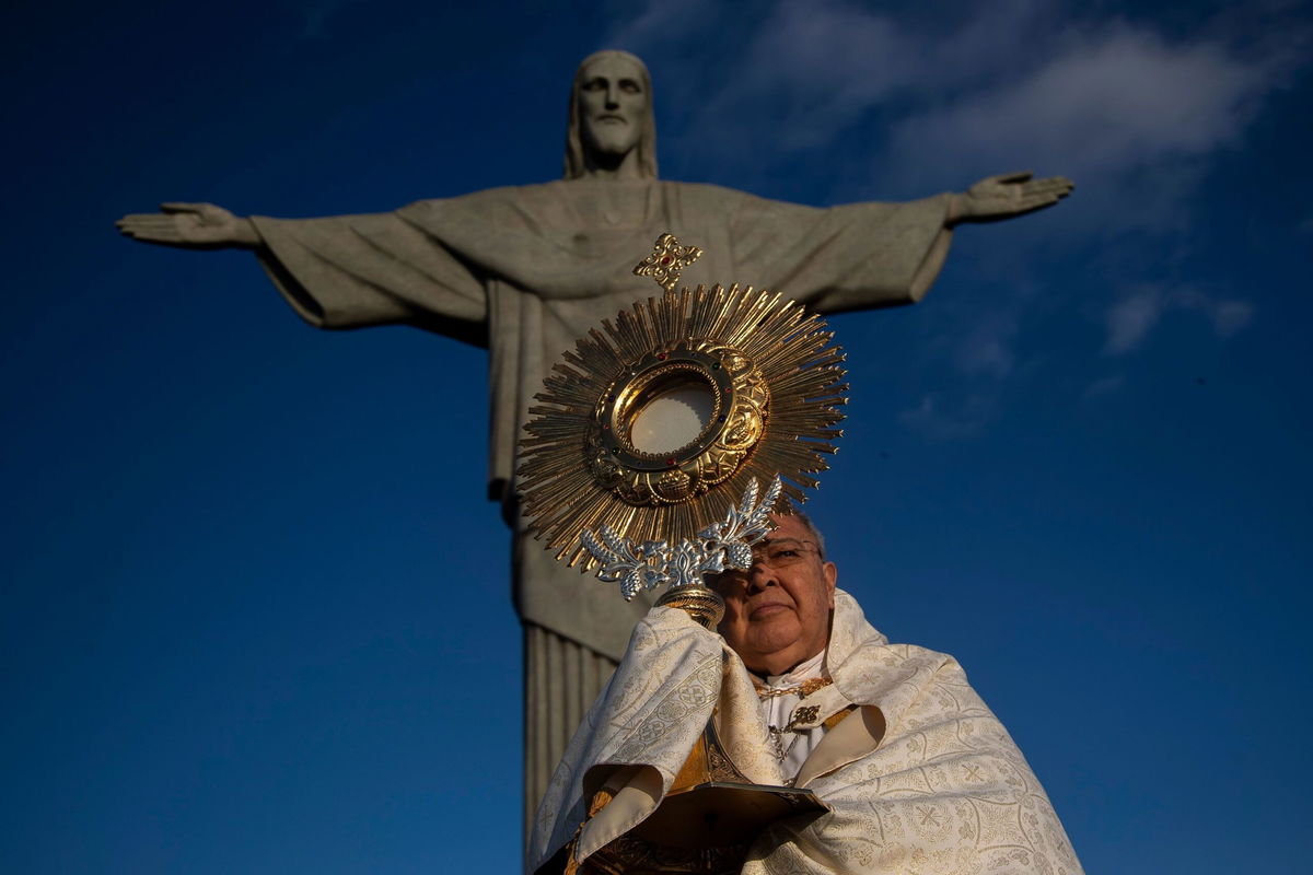 <i>Bruna Prado/AP via CNN Newsource</i><br/>Rio de Janeiro's Archbishop Orani Tempesta leads a Catholic Mass at the Christ the Redeemer statue in Rio de Janeiro on May 30.