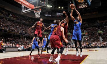 Kevin Durant shoots the ball in his first game as a Warrior against the defending champs.