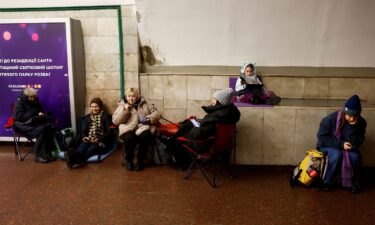 People take shelter at a metro station during an air raid alert in Kyiv