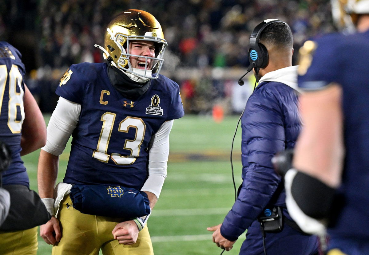 <i>Matt Cashore/USA Today Sports/Reuters via CNN Newsource</i><br/>Notre Dame Fighting Irish quarterback Riley Leonard celebrates with head coach Marcus Freeman after scoring a touchdown during the second half against the Indiana Hoosiers at Notre Dame Stadium.